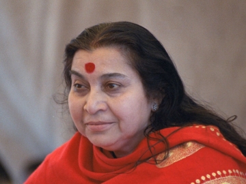Shri Mataji Nirmala Devi, head and shoulders in a red shawl