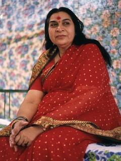 Shri Mataji sitting in pendal, red sari