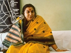 Shri Mataji sitting on couch for a speech